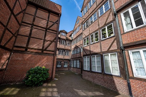 Facades of the historic brick buildings, inner courtyard, view over the city, Peterstraße,