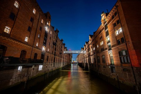 Illuminated warehouses in Hamburg's Speicherstadt, blue hour, Hamburg, Germany