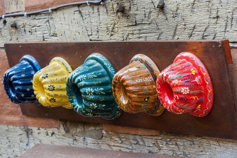 Traditional colourful Guglhupf cake tins from a bakery in Kaysersberg