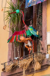Decorated house wall with stork and baby in the old town centre of Ribeauvillè