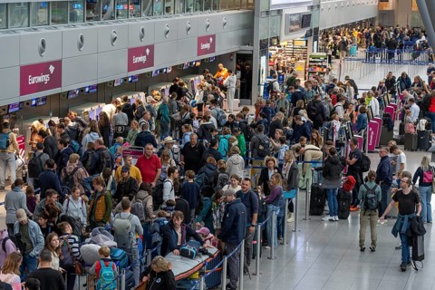 Full check-in hall, queues, Terminal B, many thousands of people take off on the first day of the