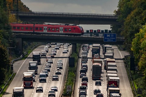 Local train crossing the A3 motorway between the Hilden junction and the Mettmann junction, view to