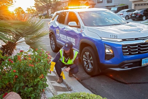 Las Vegas, Nevada - Devyn Choltko, a water waste investigator, patrols a residential neighborhood
