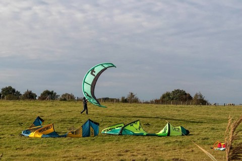 Kitesurfer packing up, Falshöft, Pommerby, Schleswig-Holstein, Germany