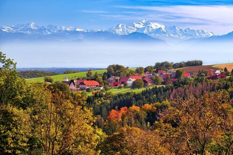 Village of Juriens in the Vaud Jura with view of Mont Blanc, haze over Lake Geneva, autumn-coloured