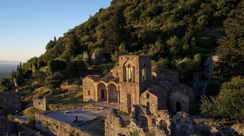 Church of Agia Sophia from the 14th century AD, An ancient church and ruins are bathed in warm