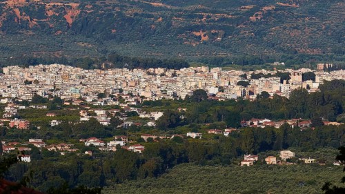 Panorama of a sprawling city in the middle of a green landscape under a blue sky, Sparta, Mystras,