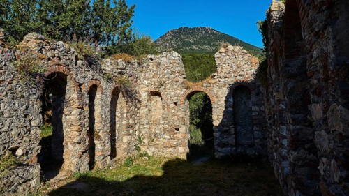 Stone ruins with arched passageways and mountain in the background, Mystras, Mistra, UNESCO World