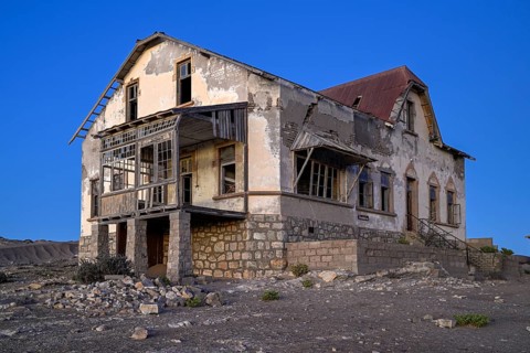 Dilapidated accountant's house in the desert sand, blue hour, Kolmanskop, near Lüderitz, Karas