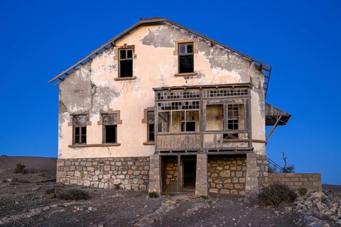 Dilapidated building in the desert sand, blue hour, Kolmanskop, near Lüderitz, Karas region,
