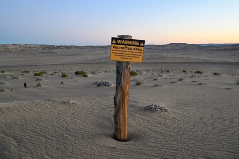 Restricted Area sign in the desert sand, Kolmanskop, diamond restricted area, near Lüderitz, Karas