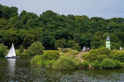 Lighthouse on an island on Lake Kemnader, people on the island, Heveney, Witten, Ruhr area, North