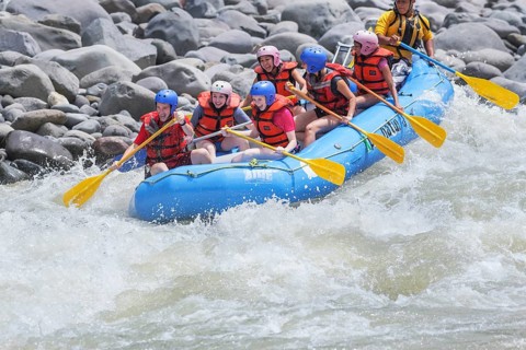 A group of people white water rafting, Costa Rica, Central America