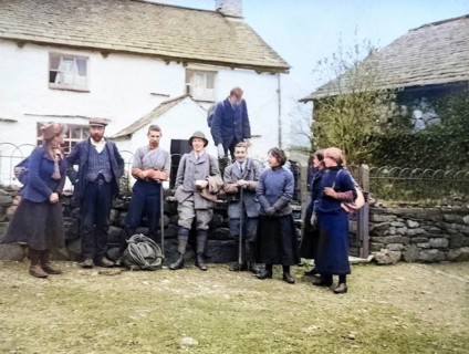 Colourised image of men and women in mountaineering mountain climbing group standing in fron of