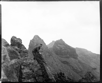 Climber on rocks, Cuillin mountains, Skye, Scotland, UK c 1900-1920 colourised image