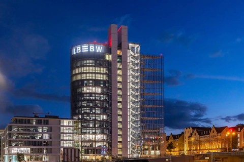 Building in the evening. Landesbank Baden-Württemberg on Heilbronner Straße. The bank's logo on the