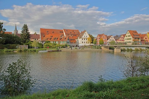 Half-timbered houses, town mill, tithe barn on the banks of the Neckar, pedestrians, boats,