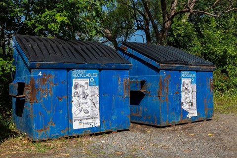 Blue metal with black plastic lid industrial size recycling bins for depositing glass, metal and