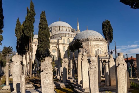 Cemetery with Ottoman gravestones in front of the Suleymaniye Mosque in Istanbul, Turkey