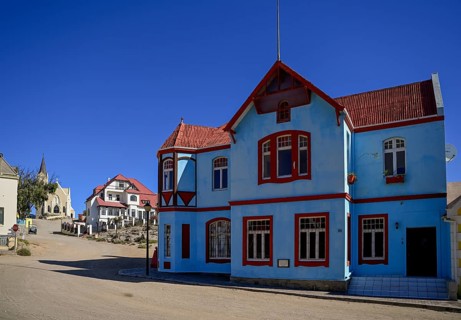 Colonial house facade in the Bergstraße, in the background the rock church, Lüderitz, Karas region,