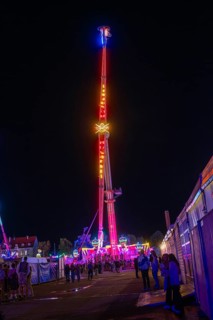 An impressive illuminated ride at a night fair, Cannstatter Wasen funfair, Stuttgart, Germany