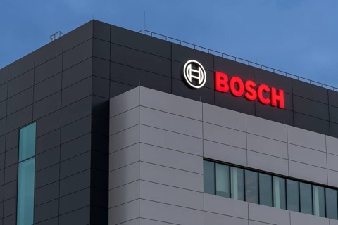 Bosch logo on grey building façade at dusk, Waiblingen, Baden-Württemberg, Germany