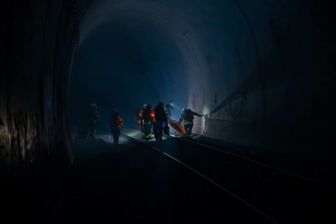 Fire brigade operation in a dark tunnel in dim light, fire brigade exercise in the new construction