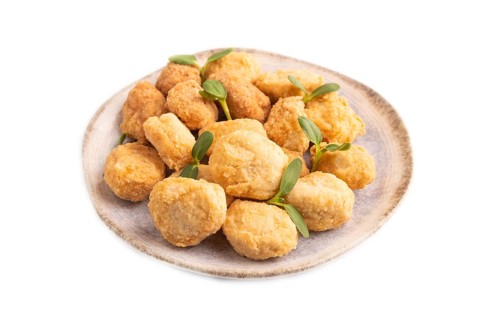 Fried crispy Chicken Nuggets with ketchup, microgreen isolated on white background. side view,