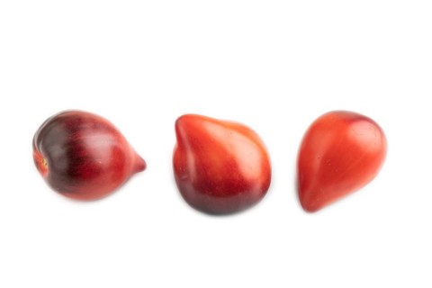 Red Heart shape tomatoes isolated on white background. Side view, copy space, healthy food,