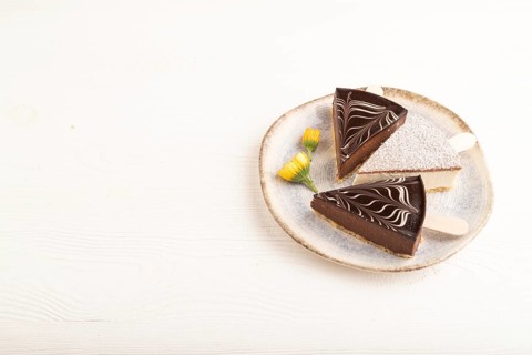 Chocolate and Vanilla Cake pops Marshmallow on white wooden background. side view, copy space