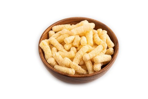 Corn flakes sticks with caramel in wooden bowl isolated on white background. side view, close up
