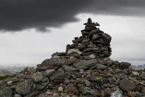 Stones deposited by pilgrims, stone pyramid, Allmannrøysa, Olav's Way or Olavsleden, old Kongevegen