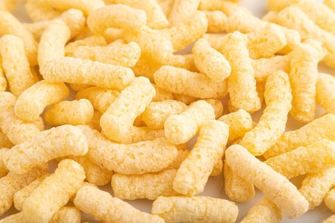 Corn flakes sticks with caramel isolated on white background. top view, flat lay, close up