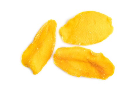 Dried Mango isolated on white background. Top view, close up, flat lay. healthy food, minimalism