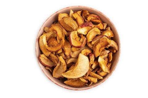 Dried Apples in ceramic bowl isolated on white background. Top view, close up, flat lay. healthy