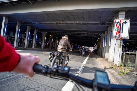 Riding a bike on a bike lane, at Essen main station, tunnel in the city centre of Essen, North