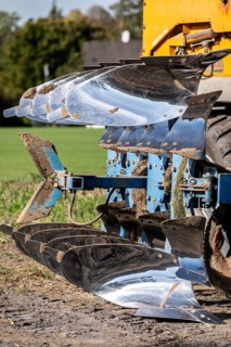 Plough, for ploughing a field, field, ploughshares, agricultural technology, shiny stainless steel,
