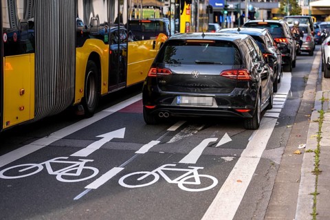Cycle path, cycle lane, marked in red to draw the attention of motorists to the cycle path, between