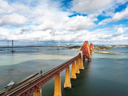 Forth Bridge from a drone, Queensferry Crossing, Forth Estuary, Scotland, United Kingdom