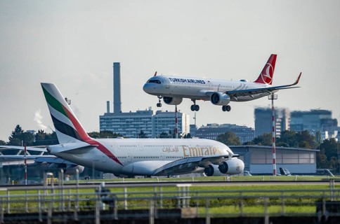 Turkish Airlines Airbus A321neo lands at Düsseldorf Airport, Emirates Airbus A380 taxis for