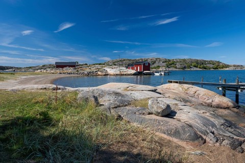 Falun red or Swedish red boathouse in a small bay, Resö island, Bohuslän, Skagerrak, Sotenäs,