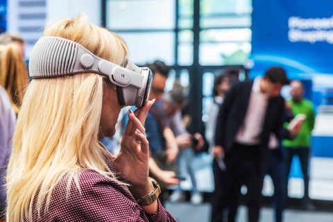 Mercedes exhibition stand. The Virtual Ride. Trade fair visitor with 3D glasses. IAA MOBILITY in