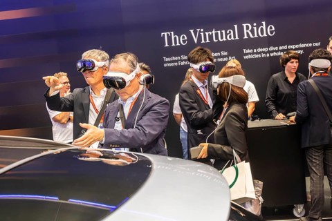 Mercedes trade fair stand with virtual presentation. Trade fair visitors with 3D glasses. The