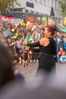 A dancer holds torches in her hand and fascinates the audience with her performance, Feuernacht,
