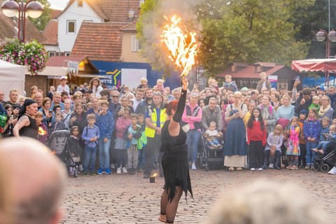 A fire dancer gives an impressive performance in front of an enthusiastic crowd, Feuernacht,