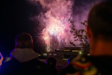 A spectacular firework display unfolds in the night sky while spectators watch, Fire Night,