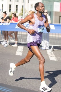 Guye Adola (ETH), later in 4th place, at KM38 in front of Potsdamer Platz at the 51st BMW Berlin