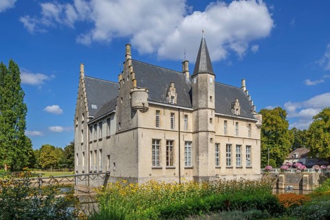 Kasteel Cortewalle, 15th century moated castle in Flemish Renaissance style at Beveren in summer,