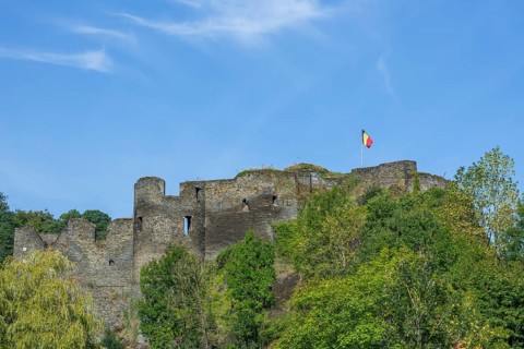 9th century medieval ruined hill castle overlooking the city La Roche-en-Ardenne in summer,