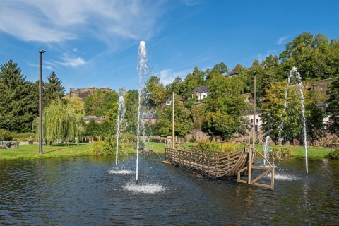 Rompré city park and ruined medieval castle in the town La Roche-en-Ardenne in summer, province of